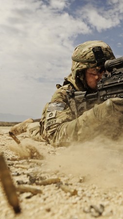 soldier, M249 LMG machine gun U.S. Army, firing, dust, sand (vertical)