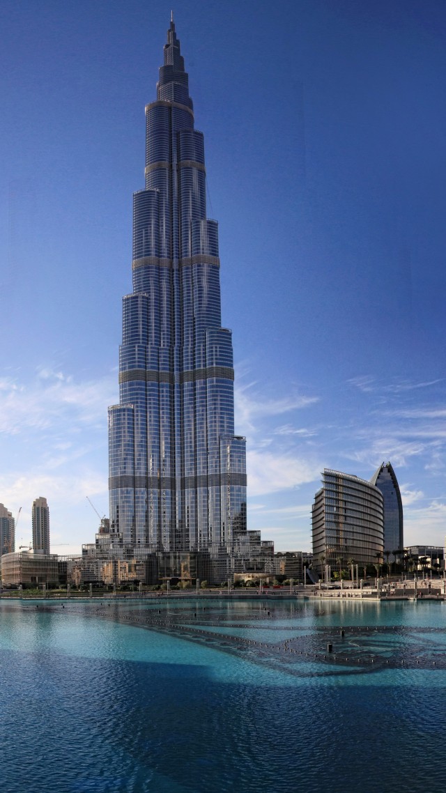 Khalifa Tower, Dubai, sky, clouds, water, pool, hotel, resort, travel, booking, vacation (vertical)