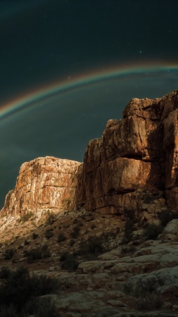 desert night wallpaper, rainbow sky, canyon view, background for mobile wallpaper (vertical)