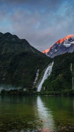 waterfalls, 5k, 4k wallpaper, mountains, sunset, lake, beach, foliage, plants, sky, clouds (vertical)