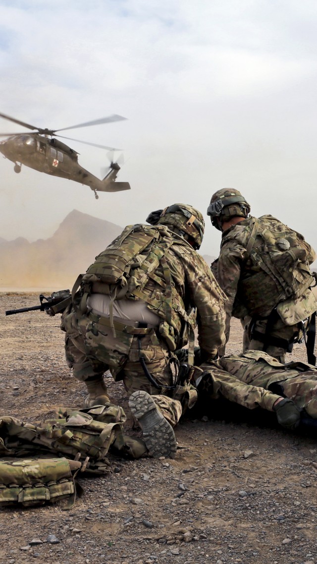 soldier, rescue mission, helicopter, uniform, desert (vertical)
